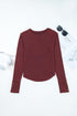 Exposed Seam Ribbed Curved Hem Button Cuff Crewneck Long Sleeve Top